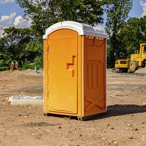 what is the cost difference between standard and deluxe portable restroom rentals in Vinco